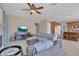 Open living room with a ceiling fan that flows into the kitchen area at 9017 Cotton Rose Way, Las Vegas, NV 89134