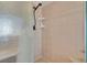 Shower with glass door, tiled walls and floors, plus shelves for soaps at 9017 Cotton Rose Way, Las Vegas, NV 89134