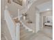 Carpeted staircase with white railings leads to the upper level; bright and open at 9017 Cotton Rose Way, Las Vegas, NV 89134