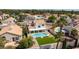 Expansive aerial view showcases a pool home, lush landscaping, and a beautifully maintained neighborhood at 9817 Dardanelle Ct, Las Vegas, NV 89117