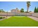 Well-maintained backyard with a putting green and lush landscaping, perfect for outdoor enjoyment at 9817 Dardanelle Ct, Las Vegas, NV 89117