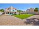 Spacious backyard with a pool and putting green, great for recreation and relaxation at 9817 Dardanelle Ct, Las Vegas, NV 89117