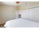 Neutral bedroom features large closet and view to upstairs hallway at 9817 Dardanelle Ct, Las Vegas, NV 89117