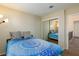 Another view of the bedroom shows a mirrored closet and hallway access at 9817 Dardanelle Ct, Las Vegas, NV 89117