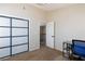 Home office features a frosted glass closet and view to upstairs hallway at 9817 Dardanelle Ct, Las Vegas, NV 89117