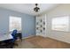 Bright bedroom with a desk and a white shelving unit for storage at 9817 Dardanelle Ct, Las Vegas, NV 89117