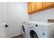 Modern laundry room equipped with a washer and dryer at 9817 Dardanelle Ct, Las Vegas, NV 89117