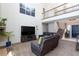 Bright and airy living room with high ceilings, fireplace, and comfortable seating at 9817 Dardanelle Ct, Las Vegas, NV 89117