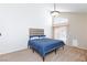 Bright primary bedroom features high ceilings, carpet flooring, and sliding glass doors to the backyard at 9817 Dardanelle Ct, Las Vegas, NV 89117