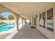 Charming covered patio with a pool view, perfect for relaxing and entertaining outdoors at 9817 Dardanelle Ct, Las Vegas, NV 89117