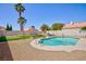 Backyard features a refreshing pool, putting green, and desert landscaping at 9817 Dardanelle Ct, Las Vegas, NV 89117