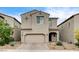 Charming two-story home features a neutral stucco exterior and a convenient two-car garage at 9870 Fisher Bay Ct, Las Vegas, NV 89178