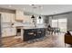 Modern kitchen featuring a large center island, stainless steel appliances, and an adjacent dining area at 9870 Fisher Bay Ct, Las Vegas, NV 89178