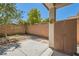 Private patio with desert landscaping, offering a tranquil space for relaxation or outdoor dining at 10121 Iron Wood Peak Ave, Las Vegas, NV 89166