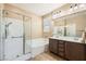 Bright bathroom with a tub-shower combo, and a double sink vanity at 10121 Iron Wood Peak Ave, Las Vegas, NV 89166