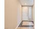 Clean entryway features tile flooring and a neutral color palette at 10121 Iron Wood Peak Ave, Las Vegas, NV 89166