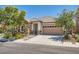 Well-maintained single story home featuring stone accents and a spacious two-car garage at 10121 Iron Wood Peak Ave, Las Vegas, NV 89166