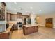 Modern kitchen with stainless appliances, tile floors, dark wood cabinets and center island with granite countertops at 10121 Iron Wood Peak Ave, Las Vegas, NV 89166