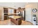 Modern kitchen with stainless steel appliances, granite countertops, and ample cabinet space at 10121 Iron Wood Peak Ave, Las Vegas, NV 89166