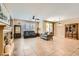 Spacious living room with tile flooring, a fireplace, and comfortable seating at 10121 Iron Wood Peak Ave, Las Vegas, NV 89166