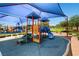 Vibrant community playground featuring covered play structures, slides and safety-first surfaces at 10121 Iron Wood Peak Ave, Las Vegas, NV 89166
