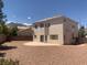 Backyard featuring neutral rock landscaping, patio, and views at 10357 Bent Willow Ave, Las Vegas, NV 89129