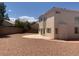 Backyard featuring neutral landscaping, block wall and a patio at 10357 Bent Willow Ave, Las Vegas, NV 89129