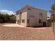 Spacious backyard with stone landscaping, patio, and partial fencing at 10357 Bent Willow Ave, Las Vegas, NV 89129