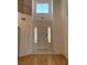 Bright entryway featuring tile flooring, a high ceiling, and a stylish pendant light at 10357 Bent Willow Ave, Las Vegas, NV 89129