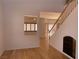 Spacious living room with hardwood floors, natural light, and an open layout leading to staircase at 10357 Bent Willow Ave, Las Vegas, NV 89129
