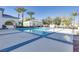 Resort-style community pool with a lounging area, and blue trim at 10357 Bent Willow Ave, Las Vegas, NV 89129