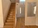 Wooden staircase with hardwood floors leading to the upper level of the home at 10357 Bent Willow Ave, Las Vegas, NV 89129