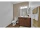 This bathroom features a stylish vanity with a wooden base and a neutral color scheme at 10450 Gold Shadow Ave, Las Vegas, NV 89129