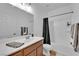 Bathroom featuring a modern vanity with a sink, a shower with a curtain, and neutral colors at 10450 Gold Shadow Ave, Las Vegas, NV 89129