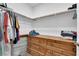 Walk-in closet featuring wood floors, built in dresser, and closet rod with organized clothing at 10450 Gold Shadow Ave, Las Vegas, NV 89129