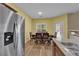 Bright dining area with stainless steel refrigerator and lots of natural light at 10450 Gold Shadow Ave, Las Vegas, NV 89129