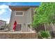 Lovely outdoor patio with charming stonework, red umbrella, and seating at 10450 Gold Shadow Ave, Las Vegas, NV 89129