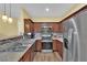 Modern kitchen featuring stainless steel appliances and granite countertops at 10450 Gold Shadow Ave, Las Vegas, NV 89129