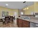 Open concept kitchen and dining area featuring stainless steel appliances at 10450 Gold Shadow Ave, Las Vegas, NV 89129