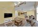 Bright, open-concept living room seamlessly connecting to the modern kitchen at 10450 Gold Shadow Ave, Las Vegas, NV 89129