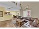 Open-concept living space with high ceilings and modern laminate flooring at 10450 Gold Shadow Ave, Las Vegas, NV 89129