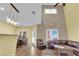 Spacious living room and dining area, featuring hardwood floors and large windows at 10450 Gold Shadow Ave, Las Vegas, NV 89129