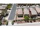 Aerial view showcasing backyard landscaping and neighborhood layout with tree-lined streets at 10650 Little Horse Creek Ave, Las Vegas, NV 89129