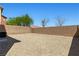 An enclosed backyard with gravel landscaping and a brick perimeter wall at 10650 Little Horse Creek Ave, Las Vegas, NV 89129