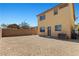 Backyard space with gravel, block fence, air conditioner unit and rear entrance at 10650 Little Horse Creek Ave, Las Vegas, NV 89129