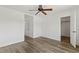 Open bedroom space with closet, entrance and wood look floors at 10650 Little Horse Creek Ave, Las Vegas, NV 89129