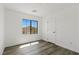Well-lit bedroom with wood-look floors and natural light at 10650 Little Horse Creek Ave, Las Vegas, NV 89129