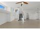 Bright and airy entryway with tile floors and a staircase to the upper level at 10650 Little Horse Creek Ave, Las Vegas, NV 89129