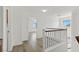 Upstairs hallway featuring neutral colors and wood-look floors at 10650 Little Horse Creek Ave, Las Vegas, NV 89129