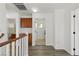Hallway with wood-look floors leading to laundry and bathroom at 10650 Little Horse Creek Ave, Las Vegas, NV 89129